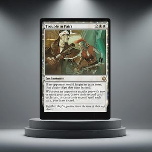 May include: A Magic: The Gathering card named "Trouble in Pairs." The card shows an illustration of two figures in a post-apocalyptic style. The card is displayed on a black pedestal against a neutral background.