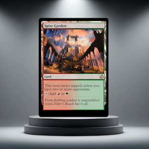 May include: A Magic: The Gathering card named "Spire Garden" featuring a castle landscape. The card is divided into red and green sections, with text detailing its use. The card is presented on a grey pedestal.