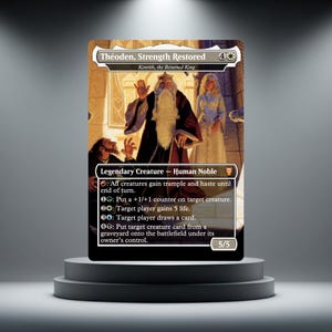 May include: A rectangular trading card titled Théoden, Strength Restored, featuring an illustration of a bearded king in robes with two other figures. The card displays game text, mana symbols, and a 5/5 power and toughness rating at the bottom.