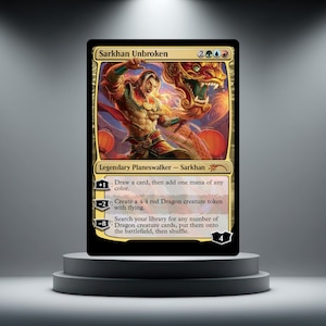 May include: A Magic: The Gathering trading card titled Sarkhan Unbroken, featuring a legendary planeswalker character with a dragon. The card displays abilities with plus one, minus two, and minus eight loyalty costs, and a starting loyalty of four.