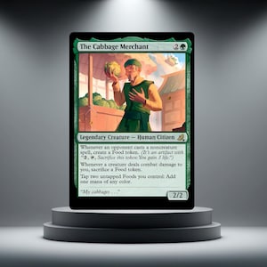 May include: A green Magic: The Gathering card featuring "The Cabbage Merchant." The card shows a man holding a cabbage, with text detailing its abilities. The card is displayed on a black pedestal.