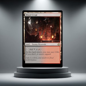 May include: A Magic: The Gathering card named "Blood Crypt" on a plinth. The card displays a dark, gothic illustration with the text "Land - Swamp Mountain." The card's text includes instructions and a quote: "Life is a show, and death its final performance."