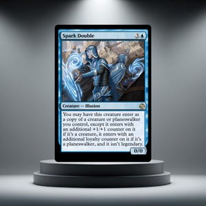 May include: A Spark Double trading card featuring a blue-clad figure in a hooded cloak casting swirling magical energy. The card text describes the creature as an illusion with a 0/0 power and toughness, set against a light blue background.