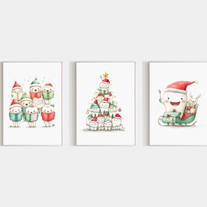 May include: Set of three framed watercolor prints featuring anthropomorphic teeth in festive Christmas scenes. One shows teeth caroling, another a tooth Christmas tree, and the last a tooth in a sleigh with a reindeer.