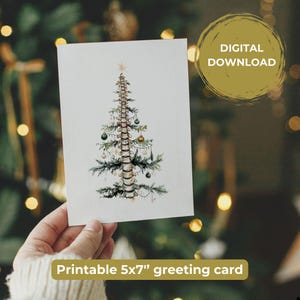 May include: A 5x7 inch printable greeting card featuring a unique Christmas tree design. The tree is illustrated with a spine-like structure, adorned with ornaments and a star. The card is labeled "Digital Download".