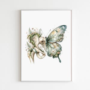 May include: A vertical art print featuring a hybrid illustration where the left side depicts a human pelvic bone overgrown with green ferns and small wildflowers, while the right side transitions into a butterfly wing with a forest landscape scene.