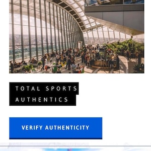 May include: A mobile website interface for Total Sports Authentics featuring a header with a menu icon and shopping cart. The page displays a large image of a glass-enclosed indoor garden space, followed by a black button labeled TOTAL SPORTS AUTHENTICS.