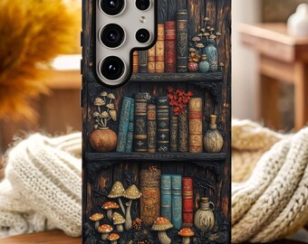 May include: A phone case featuring a detailed illustration of a bookshelf with books, mushrooms, and decorative items. The case has a dark wood-like background with a variety of colors, including orange, brown, and blue.