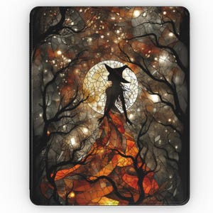 May include: A black rectangular case featuring a witch silhouette against a full moon in a forest. The witch is wearing a pointed hat and flowing dress. The background includes bare trees and sparkling lights, with a color palette of orange, brown, and black.