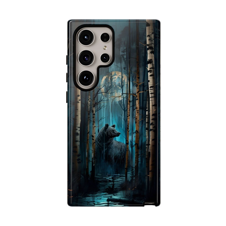 May include: A black bear stands in a dark forest with a full moon in the background. The trees are tall and slender with white bark. The bear is looking to the right of the image.