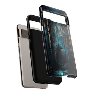 May include: A black phone case with a blue and black design of a bear standing in a forest with a full moon in the background.