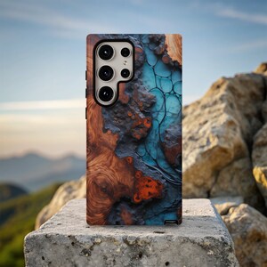 May include: A phone case with a wood and blue resin design. The case has a camera cutout with three lenses.