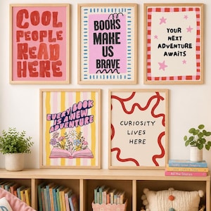 May include: Five framed wall art prints with text including COOL PEOPLE READ HERE, BOOKS MAKE US BRAVE, YOUR NEXT ADVENTURE AWAITS, EVERY BOOK IS A NEW ADVENTURE, and CURIOSITY LIVES HERE, displayed above a wooden bookshelf filled with books.