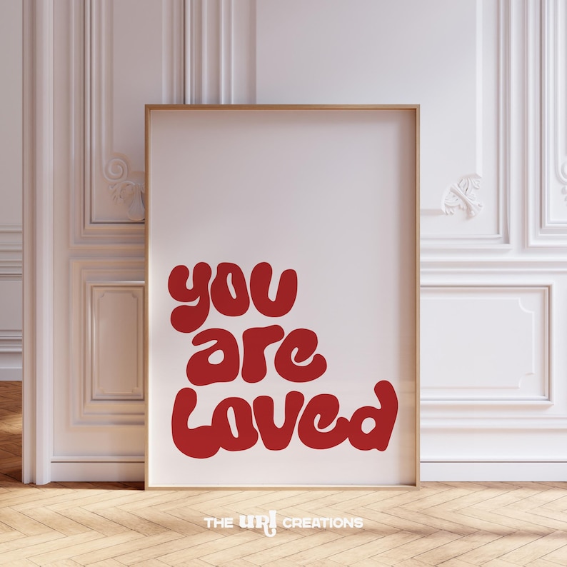 This You Are Loved Wall Art is a Christian inspired wall art. It has a funky playful font text in color Red on white background. Perfect for Valentines Day decor, Girls Bedroom Decor, and a gift for daughter