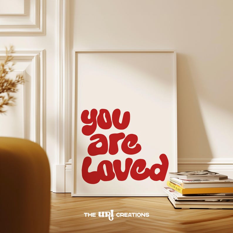 This You Are Loved Wall Art is a Christian inspired wall art. It has a funky playful font text in color Red on white background. Perfect for Valentines Day decor, Girls Bedroom Decor, and a gift for daughter
