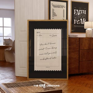 May include: Framed art prints with inspirational quotes. The main print features a note-like design with the text "You don't know what I am doing now but you will understand later." Two other framed prints are visible, one with "SALVATION" and the other with "FAITH OVER FEAR."