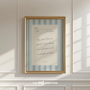 May include: A framed print with a gold-colored frame. The print features a note-like design with the text "You don't know what I am doing now, but you will understand later." The text is in black script on a cream-colored background.