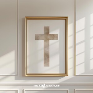 A minimalist watercolor cross printable wall art in soft, neutral earthy tones. The design features a subtle, abstract texture, creating a peaceful and elegant Christian decor piece. Perfect for Easter celebrations, religious home decor, or faith-inspired artwork.
