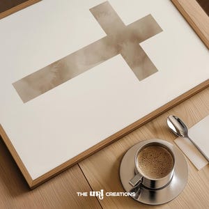 A minimalist watercolor cross printable wall art in soft, neutral earthy tones. The design features a subtle, abstract texture, creating a peaceful and elegant Christian decor piece. Perfect for Easter celebrations, religious home decor, or faith-inspired artwork.