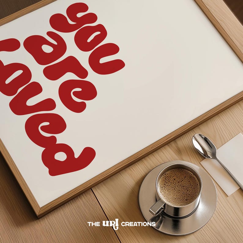 This You Are Loved Wall Art is a Christian inspired wall art. It has a funky playful font text in color Red on white background. Perfect for Valentines Day decor, Girls Bedroom Decor, and a gift for daughter