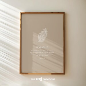 May include: A beige printable wall art print with a white palm leaf design and the text "HOSANNA" with a bible verse from John 12:13. The print has a wooden frame.