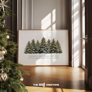 May include: A framed print featuring a watercolor painting of evergreen trees covered in snow. The text reads, "Christmas is a time to remember the greatest gift of all time: the birth of Jesus, our Savior."