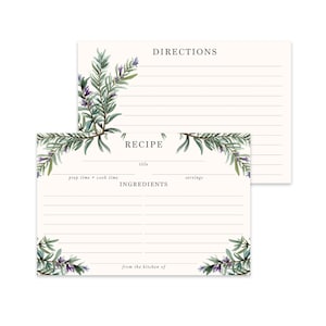 May include: A set of two recipe cards with a green and purple floral design. The cards have lines for writing down a recipe title, prep time, cook time, servings, ingredients, and directions. The text "from the kitchen of" is printed at the bottom of the card.