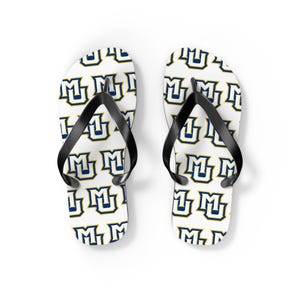 May include: A pair of white flip-flops with a repeating pattern of blue and gold "M" logos. The flip-flops have black straps and are designed for casual wear. The footwear is shown on a white background.
