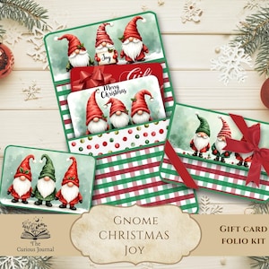 May include: Christmas-themed gift card folio kit featuring gnome illustrations. The kit includes multiple gift card holders with red and green plaid patterns, red bows, and the text "Merry Christmas". Decorative elements include ornaments and snowflakes.