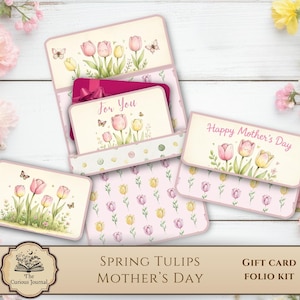 May include: A paper gift card folio kit featuring illustrations of pink and yellow tulips, butterflies, and green foliage. The set includes cards with the text For You and Happy Mother's Day, alongside a patterned paper sheet with tulip motifs.