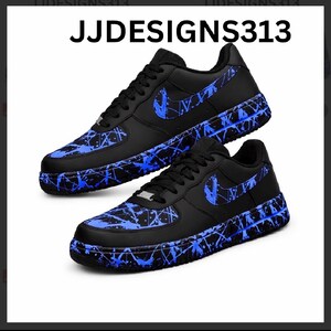 May include: Black sneakers with blue splatter paint design and a blue Nike swoosh. The shoes have black laces and a black sole. The text "JJDESIGNS313" is at the top of the image.