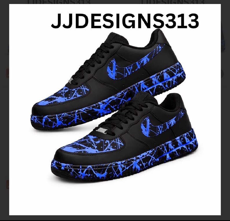 May include: Black sneakers with blue splatter paint design and a blue Nike swoosh. The shoes have black laces and a black sole. The text "JJDESIGNS313" is at the top of the image.
