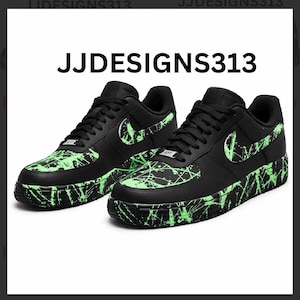 May include: Pair of black sneakers with neon green splatter paint design. The Nike swoosh and sole feature the same neon green accents. The text "JJDESIGNS313" is displayed above the shoes.