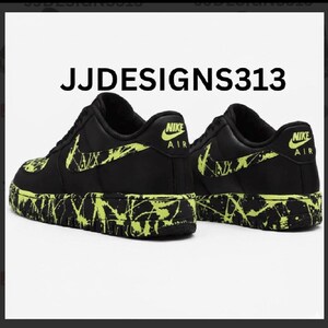May include: Black Nike Air Force 1 sneakers with neon green splatter paint design on the soles and swoosh. The text "JJDESIGNS313" is displayed above the shoes. The Nike logo is visible on the heel.