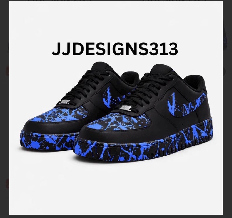 May include: Black sneakers with blue splatter paint design. The shoes feature a black Nike swoosh and the text "JJDESIGNS313". The soles and toe boxes are decorated with blue paint.