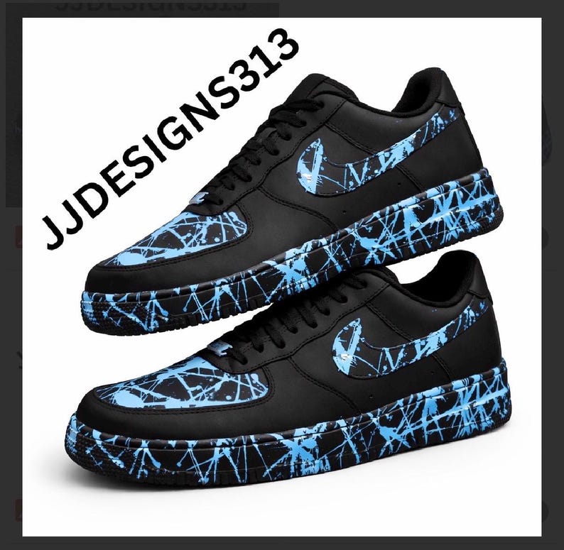 May include: Black sneakers with blue splatter paint design. The Nike swoosh logo is visible on the side. The text "JJDESIGNS313" is printed on the side of the shoe.