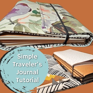 Può includere: Un semplice tutorial per un diario di viaggio con un primo piano di un diario rivestito in tessuto con un elastico nero e un motivo floreale. Il diario è aperto per rivelare pagine bianche.