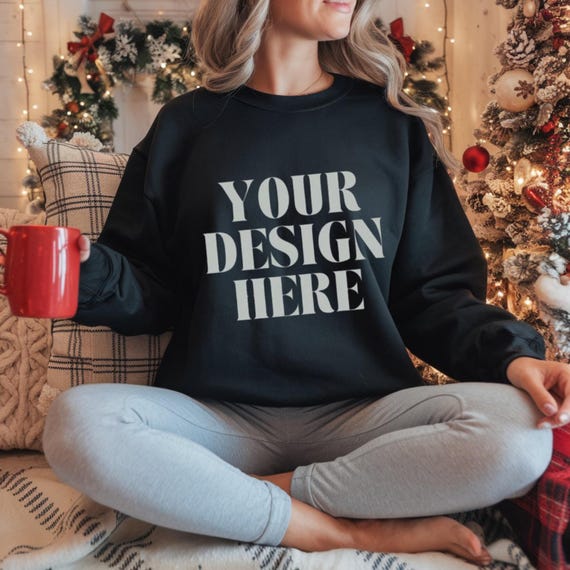 Gildan 18000 Black Sweatshirt Mockup,Black Customizable Sweatshirt Mockup with Red Mug and Christmas Background - Cozy Winter Scene,