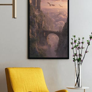 May include: Framed fantasy art print depicting a castle on a cliff, connected by a stone bridge. Two dragons fly in the sky above the clouds. The artwork is framed in black and hangs on a white wall.