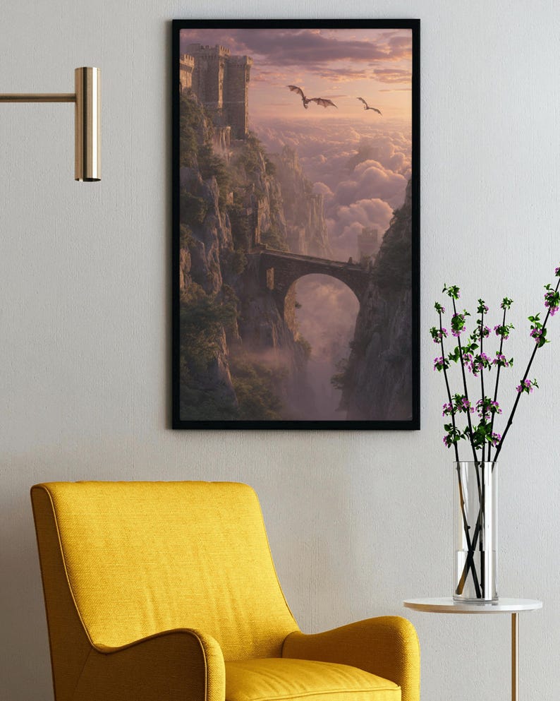 May include: Framed fantasy art print depicting a castle on a cliff, connected by a stone bridge. Two dragons fly in the sky above the clouds. The artwork is framed in black and hangs on a white wall.