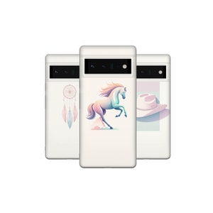 May include: Three white phone cases with different designs. The first case has a dreamcatcher with feathers, the second case has a white horse, and the third case has a cowboy hat.