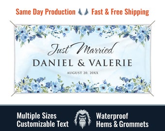 May include: A light blue wedding banner with a watercolor floral border and the text "Just Married Daniel & Valerie August 20, 20XX".