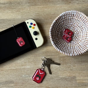 Stardew Strawberry Seeds | Nintendo Switch Charm Dust Plug | Hypoallergenic Surgical Steel Dangle Earrings | Lobster Claw Keychain
