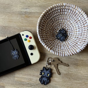 Puede incluir: Un juego de tres tazas de cer&aacute;mica con un acabado mate moteado. Las tazas son de color crema, gris claro y gris oscuro. Cada taza tiene un dise&ntilde;o simple y minimalista y un asa redondeada.