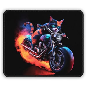 May include: A black and orange cat riding a motorcycle with flames coming out of the exhaust pipe. The motorcycle is green and chrome with a black seat. The cat is wearing a black leather jacket and has a determined look on its face.
