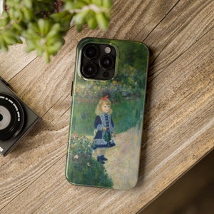May include: A phone case with a painting of a young girl in a garden. The case has a green background with a blue and white dress on the girl. The case has a camera lens cutout in the top left corner.