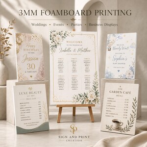 May include: A display of printed foam boards for events. Includes a wedding seating chart, birthday sign, baby shower welcome sign, and a cafe menu. The signs feature floral designs and text. The signs are displayed on easels and stands.