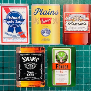 May include: Five cards with beverage-themed designs. One card reads "Island Basic Land Beer" with blue and red accents. Another says "Plains Banquet Basic Land" in yellow. A third card is "Mountain Basic Land" in red. The fourth card is "Swamp Old No.7 Basic Land". The last card is "Forest Basic 56 Land".