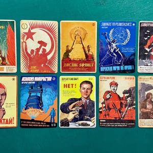 May include: A collection of ten rectangular game cards featuring propaganda-style illustrations. The cards display various figures, symbols, and text in bold colors, including red, blue, and yellow, with titles like Silence, Swords to Plowshares, and Smothering Tithe.