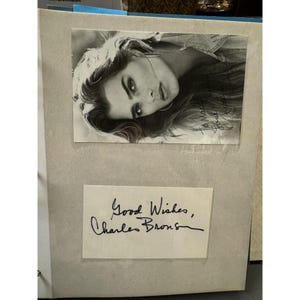 Autographed Brooke Shields Black and White Photo and Charles Bronson Signature In Display Album